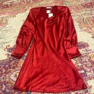 Red shoulder pad dress